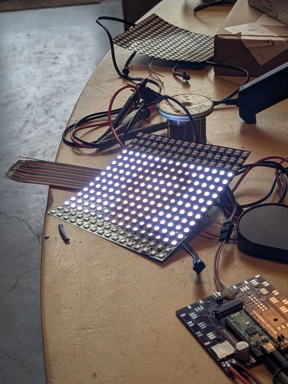 LAMP LED panel and controller prototype on a workbench