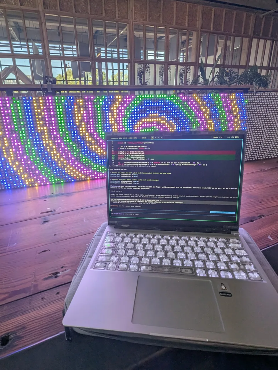 LAMP display running behind a development laptop
