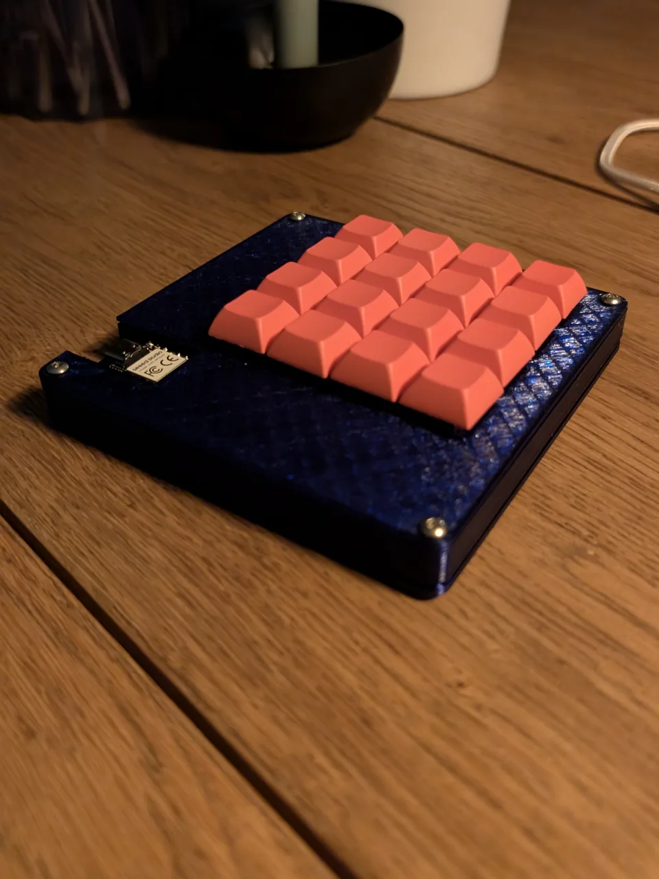 Finished MYMacropad with coral keycaps and blue enclosure